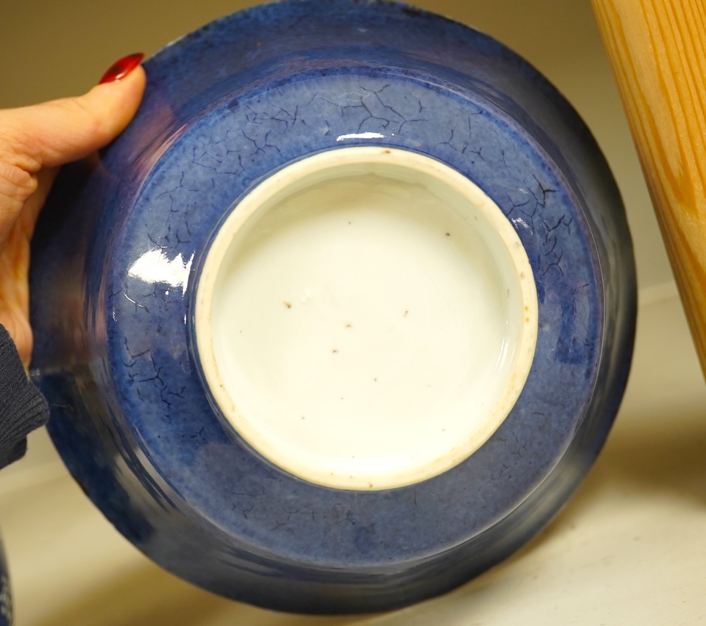A Chinese powder blue bowl, early 18th century and a Chinese blue and white prunus jar - tallest 13cm. Condition - fair